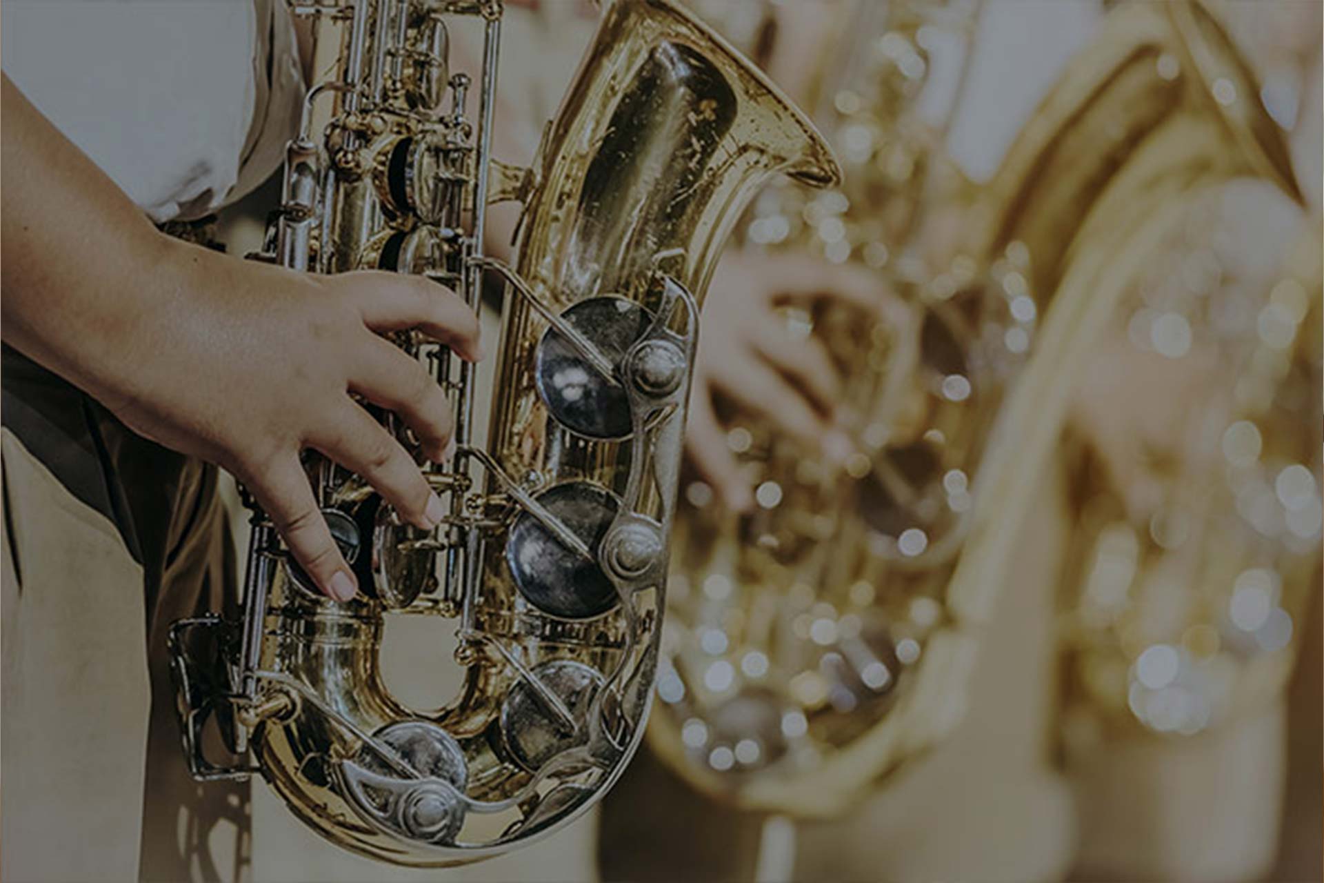 Child hand playing saxophone