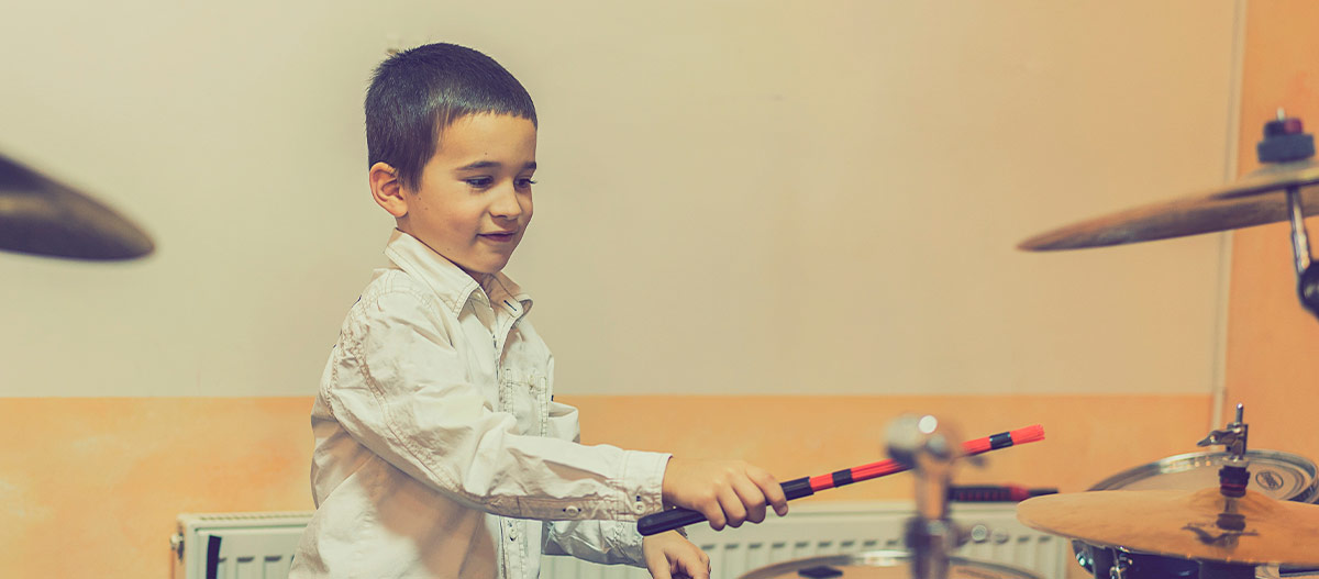 Boy playing the drums