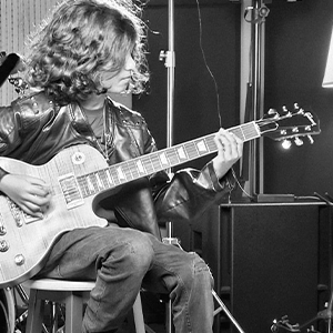 Black and white photo of junior guitarist Suryansh Sabharwal