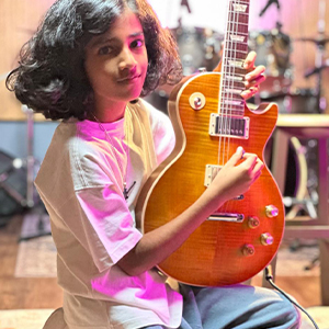 Suryansh Sabharwal posing with the guitar