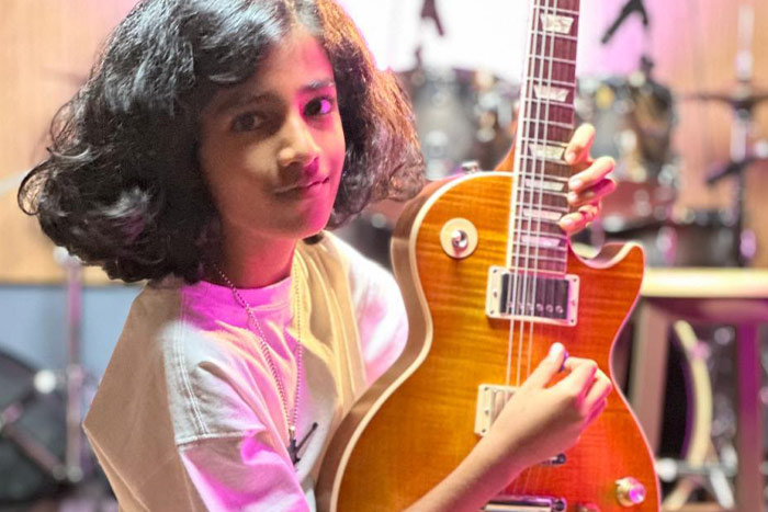 Suryansh Sabharwal posing with the guitar