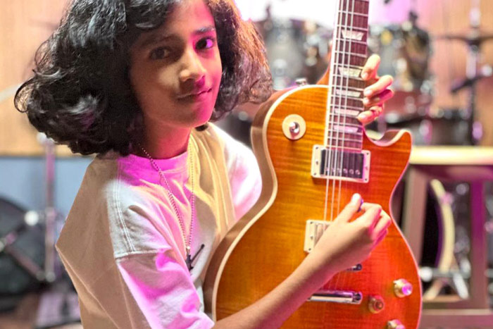 Suryansh Sabharwal posing with the guitar