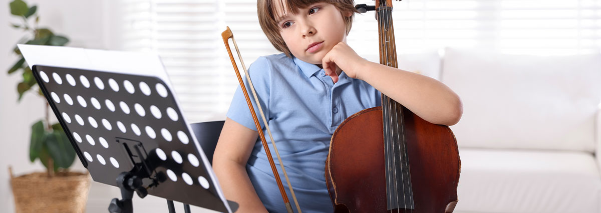 Young cellist looking and thinking
