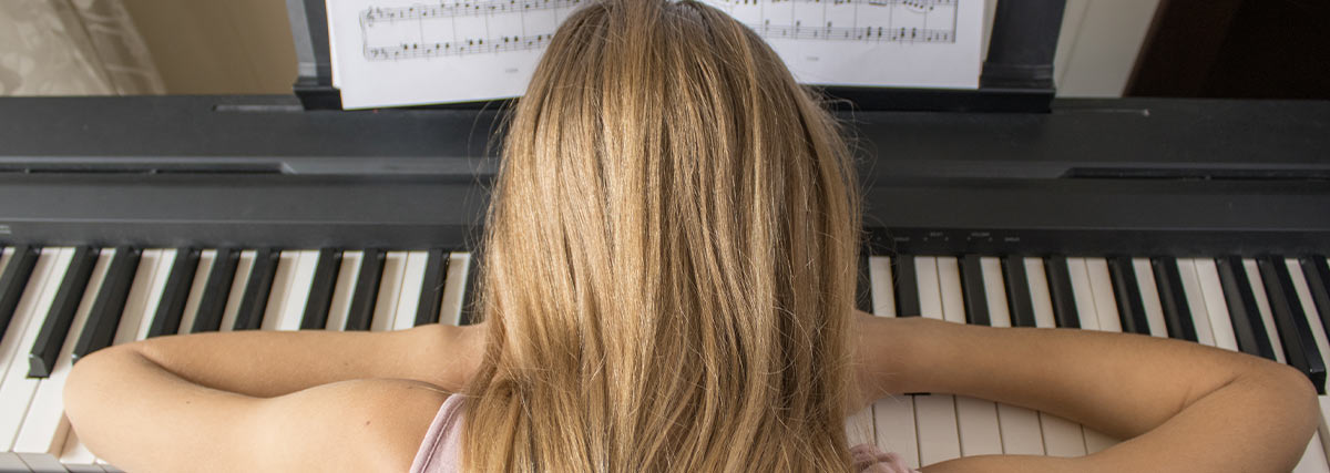 Child feeling frustrated while practising piano