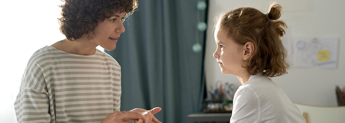 Parent having a calm conversation with a child